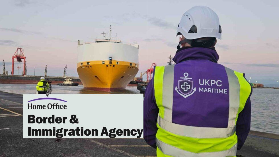 UK Patient Care Maritime Staff standing by large vessel